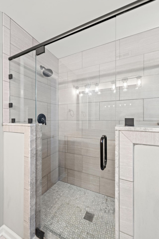 full bathroom featuring a stall shower