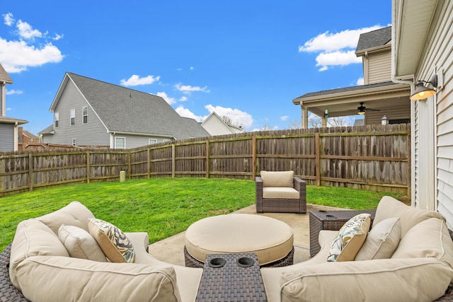 view of yard featuring a patio, an outdoor hangout area, and a fenced backyard