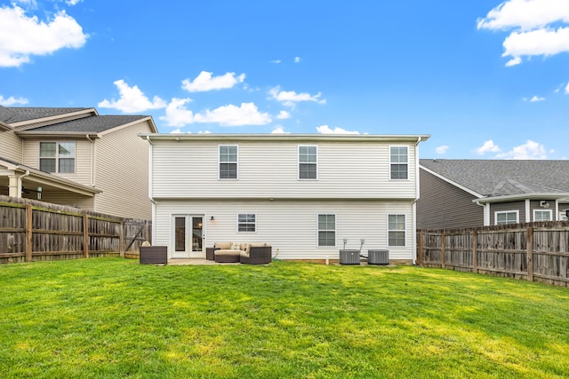 back of property with an outdoor living space, a fenced backyard, central AC unit, and a lawn