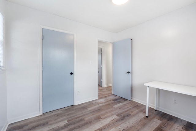 2429 Mirahill Dr, Lexington, KY 40509 - unfurnished bedroom featuring wood finished floors and baseboards