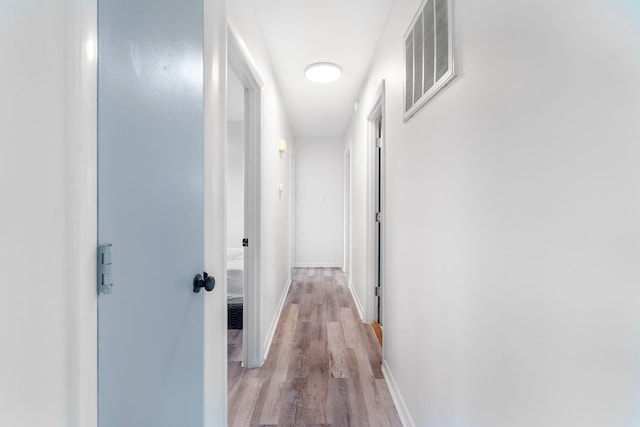 2429 Mirahill Dr, Lexington, KY 40509 - hall featuring visible vents, baseboards, and wood finished floors