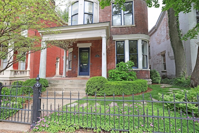 261 N Broadway, Lexington, KY 40507 - view of front facade featuring brick siding and covered porch