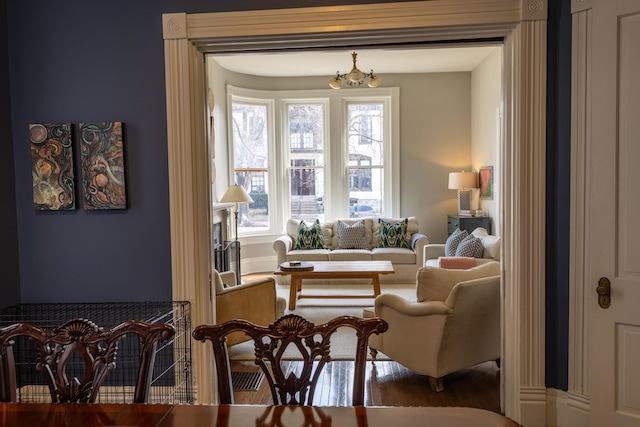 261 N Broadway, Lexington, KY 40507 - living room featuring a chandelier and wood finished floors