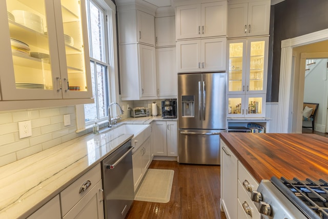 261 N Broadway, Lexington, KY 40507 - kitchen with stainless steel appliances, wooden counters, a sink, white cabinets, and dark wood finished floors