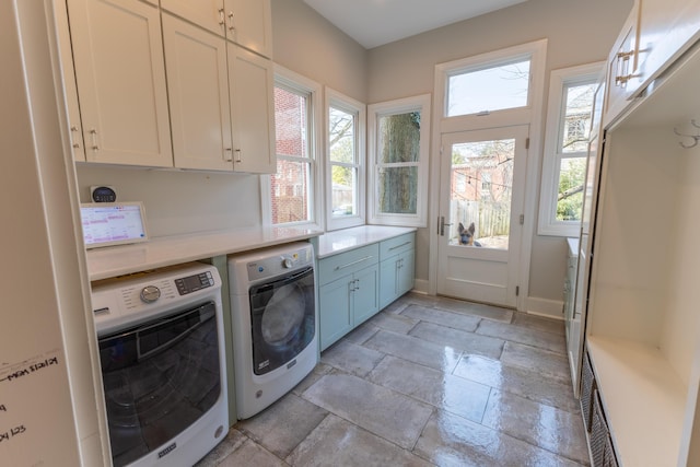 261 N Broadway, Lexington, KY 40507 - laundry area featuring cabinet space, washer and clothes dryer, and stone tile floors