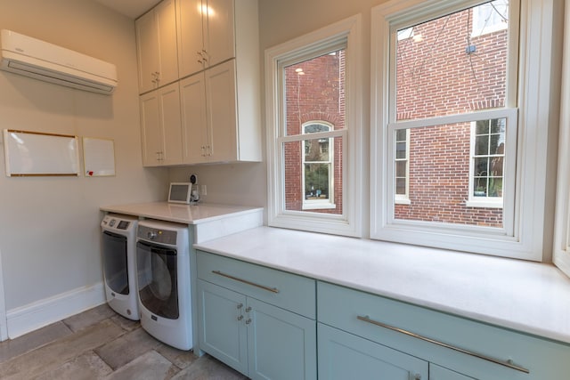 261 N Broadway, Lexington, KY 40507 - washroom featuring cabinet space, independent washer and dryer, a wall mounted AC, and baseboards