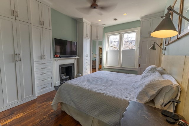 261 N Broadway, Lexington, KY 40507 - bedroom featuring dark wood-type flooring, a fireplace, recessed lighting, and a ceiling fan