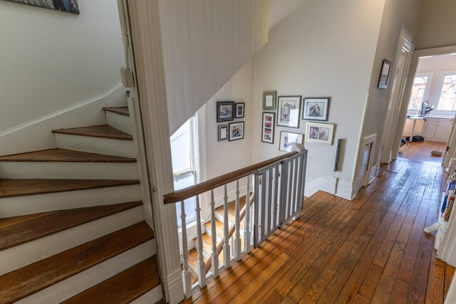 261 N Broadway, Lexington, KY 40507 - staircase with hardwood / wood-style floors and vaulted ceiling