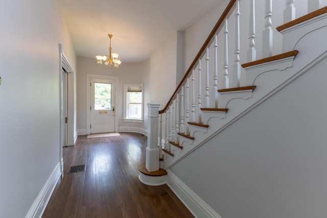 261 N Broadway, Lexington, KY 40507 - entrance foyer with baseboards, a chandelier, wood finished floors, and stairway
