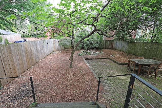 261 N Broadway, Lexington, KY 40507 - fenced backyard with a patio area