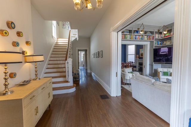 261 N Broadway, Lexington, KY 40507 - foyer entrance with dark wood-style flooring, stairway, a chandelier, and baseboards