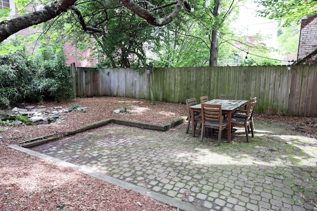 261 N Broadway, Lexington, KY 40507 - fenced backyard featuring a patio area and outdoor dining space