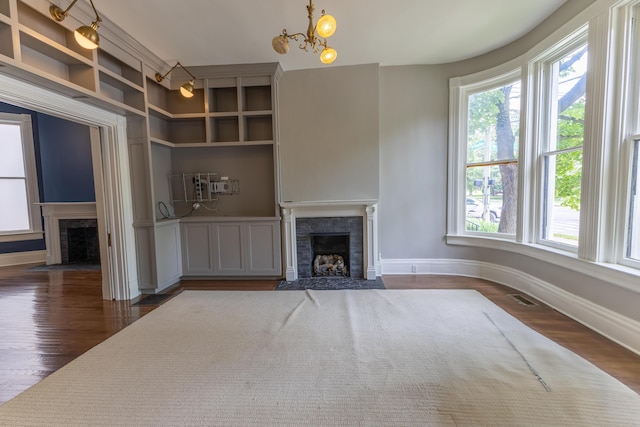 261 N Broadway, Lexington, KY 40507 - unfurnished living room with a fireplace with flush hearth, healthy amount of natural light, and baseboards