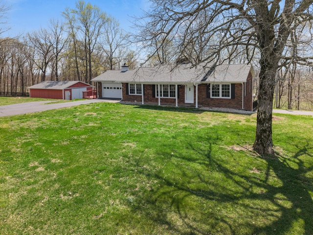 11 Hominy Hill Rd, Nancy, KY 42544 - single story home with aphalt driveway, a front yard, a chimney, brick siding, and an attached garage