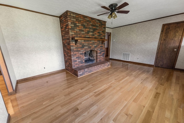 11 Hominy Hill Rd, Nancy, KY 42544 - unfurnished living room featuring ceiling fan, ornamental molding, wood finished floors, and visible vents
