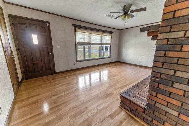 11 Hominy Hill Rd, Nancy, KY 42544 - foyer entrance with a ceiling fan, visible vents, ornamental molding, and light wood-style flooring