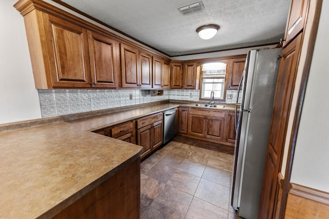 11 Hominy Hill Rd, Nancy, KY 42544 - kitchen featuring brown cabinetry, visible vents, appliances with stainless steel finishes, tasteful backsplash, and a sink