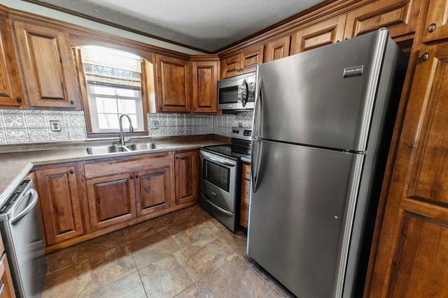 11 Hominy Hill Rd, Nancy, KY 42544 - kitchen featuring brown cabinetry, a sink, decorative backsplash, and appliances with stainless steel finishes