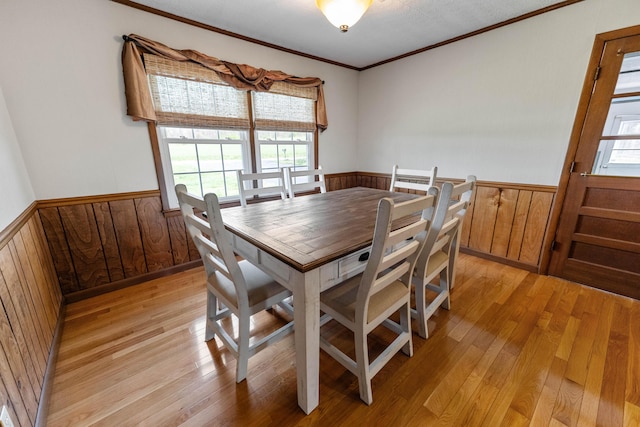 11 Hominy Hill Rd, Nancy, KY 42544 - dining room with light wood-type flooring, wood walls, wainscoting, and a healthy amount of sunlight