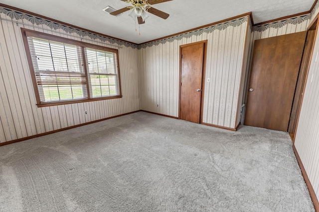 11 Hominy Hill Rd, Nancy, KY 42544 - unfurnished bedroom with crown molding, a ceiling fan, a closet, baseboards, and carpet flooring