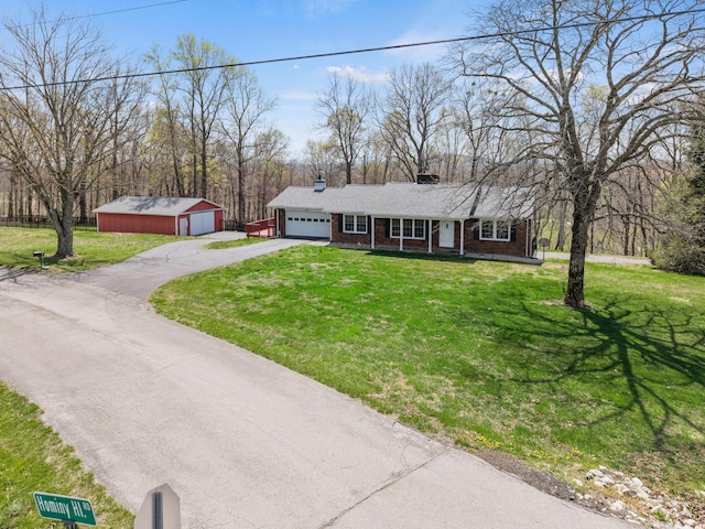 11 Hominy Hill Rd, Nancy, KY 42544 - single story home with aphalt driveway, a front yard, a chimney, brick siding, and an attached garage