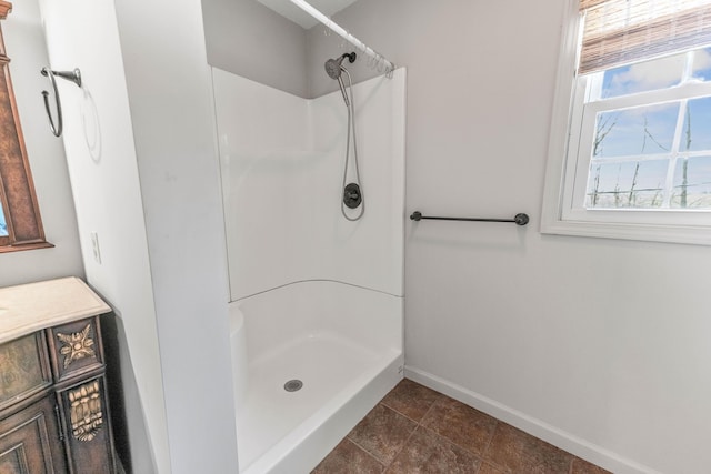 11 Hominy Hill Rd, Nancy, KY 42544 - full bathroom featuring baseboards and a shower