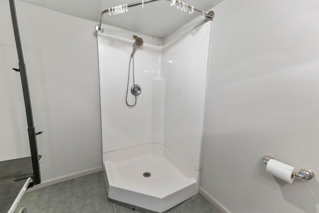 11 Hominy Hill Rd, Nancy, KY 42544 - full bathroom featuring baseboards, tile patterned flooring, and a shower stall