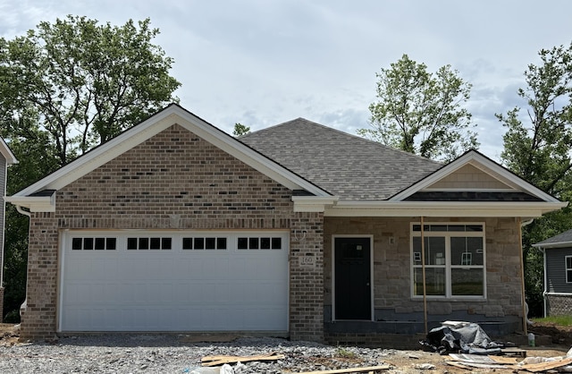 160 Bueno Xing, Georgetown, KY 40324 - view of front of home featuring a garage, a shingled roof, driveway, and brick siding