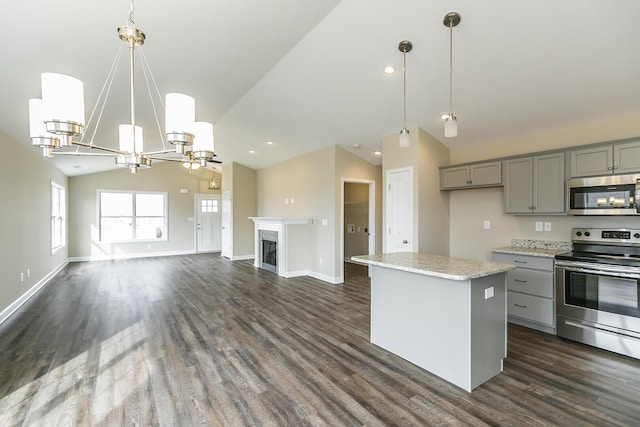 160 Bueno Xing, Georgetown, KY 40324 - kitchen with appliances with stainless steel finishes, gray cabinets, vaulted ceiling, dark wood finished floors, and a center island