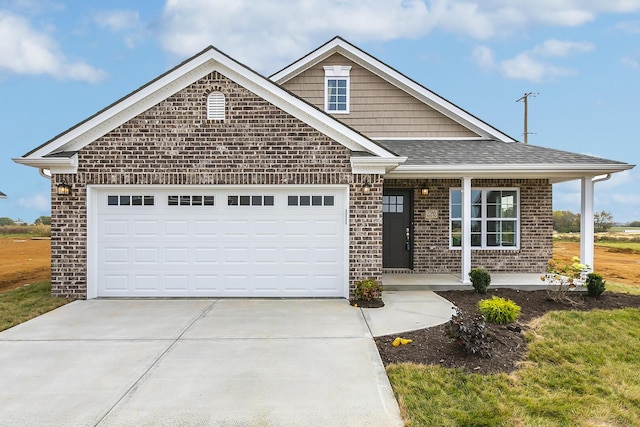 160 Bueno Xing, Georgetown, KY 40324 - view of front of property with driveway, a porch, brick siding, an attached garage, and a shingled roof