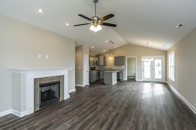 160 Bueno Xing, Georgetown, KY 40324 - unfurnished living room featuring lofted ceiling, dark wood finished floors, a ceiling fan, a chandelier, and a fireplace