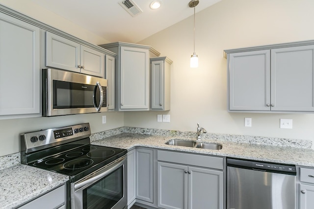 160 Bueno Xing, Georgetown, KY 40324 - kitchen with appliances with stainless steel finishes, a sink, gray cabinetry, decorative light fixtures, and light stone countertops