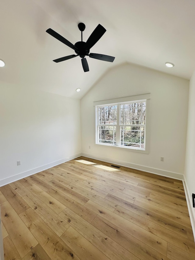 217 Dogwood Ln, Somerset, KY 42503 - spare room featuring vaulted ceiling, light wood-type flooring, baseboards, visible vents, and a ceiling fan