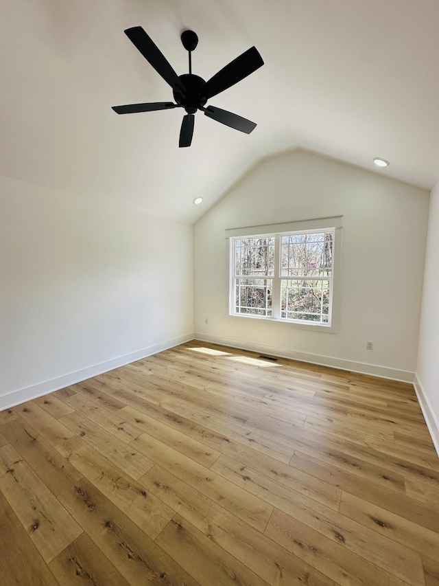217 Dogwood Ln, Somerset, KY 42503 - empty room featuring lofted ceiling, light wood-style flooring, baseboards, visible vents, and a ceiling fan