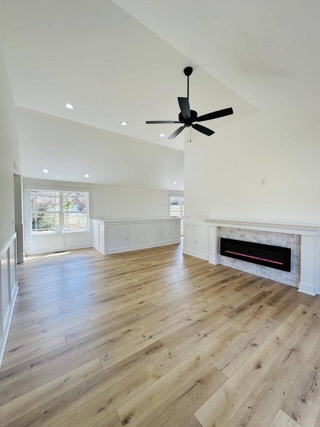217 Dogwood Ln, Somerset, KY 42503 - unfurnished living room featuring a wealth of natural light, a fireplace, ceiling fan, and light wood-type flooring