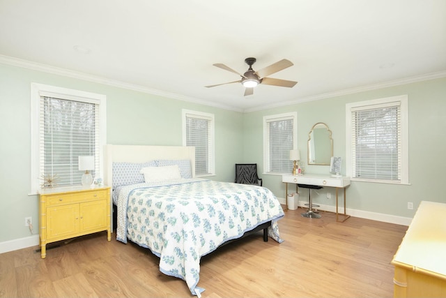 bedroom with ornamental molding, light wood-style flooring, a ceiling fan, and baseboards