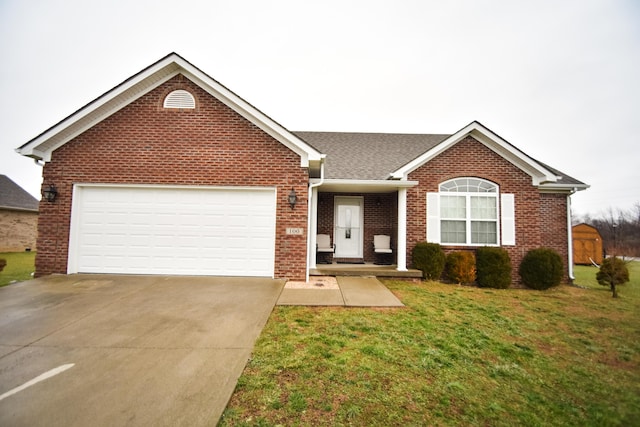 100 Twin Lakes Dr, Richmond, KY 40475 - single story home with a front yard, brick siding, concrete driveway, and an attached garage