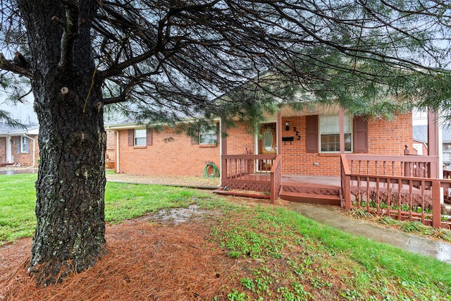 exterior space featuring a porch and brick siding