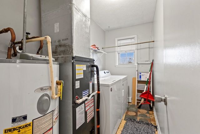 laundry area featuring independent washer and dryer, laundry area, a textured ceiling, and water heater