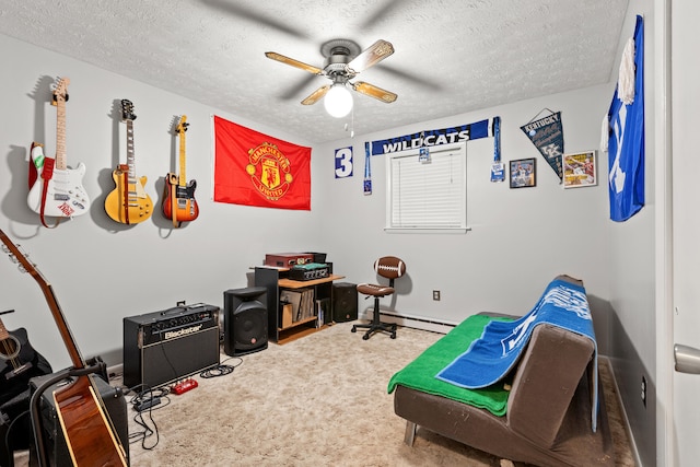 rec room with carpet floors, ceiling fan, a baseboard heating unit, and a textured ceiling