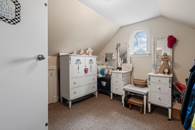 carpeted bedroom with lofted ceiling