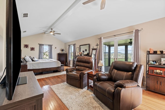 bedroom featuring lofted ceiling with beams, access to exterior, light wood-type flooring, ceiling fan, and visible vents