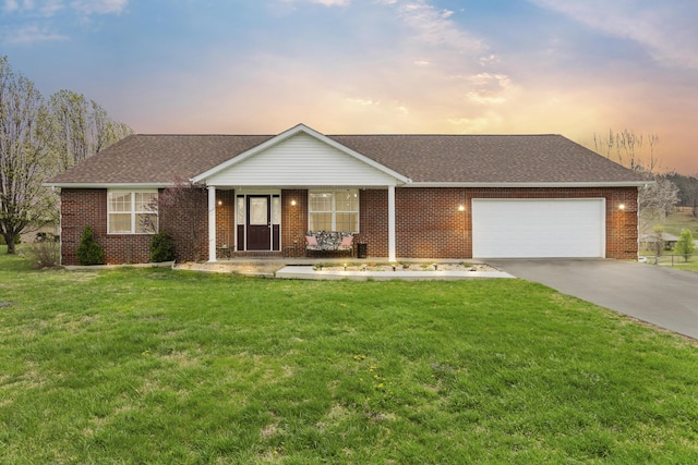 135 Country Acres Dr, Somerset, KY 42503 - ranch-style home with brick siding, an attached garage, driveway, and a lawn