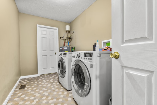 135 Country Acres Dr, Somerset, KY 42503 - laundry room with laundry area, a textured ceiling, visible vents, baseboards, and washing machine and dryer