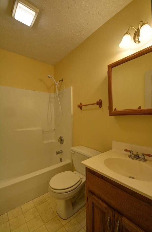 bathroom featuring vanity, tile patterned flooring,  shower combination, a textured ceiling, and toilet