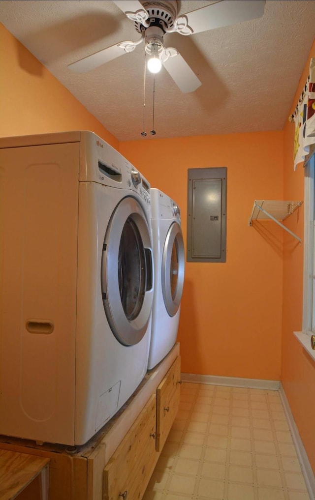 laundry area featuring electric panel, ceiling fan, laundry area, independent washer and dryer, and light floors