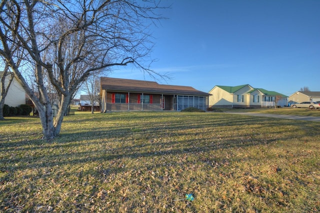 single story home featuring a front yard