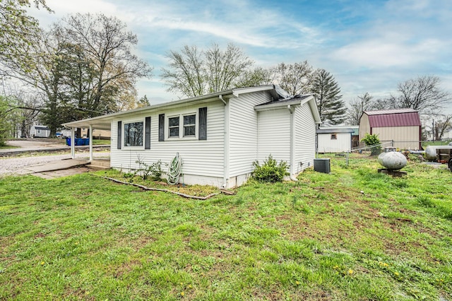 140 Wonder St, Lewisburg, KY 42256 - view of side of home with central air condition unit and an attached carport