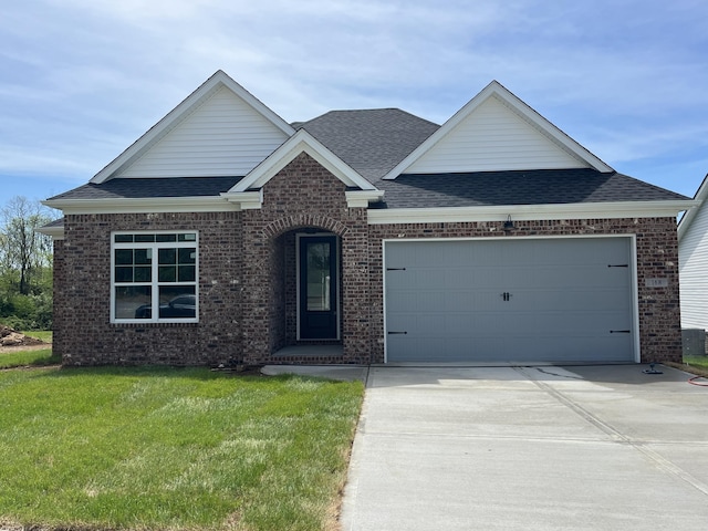 168 Bueno Xing, Georgetown, KY 40324 - view of front of property with brick siding, roof with shingles, driveway, an attached garage, and a front yard