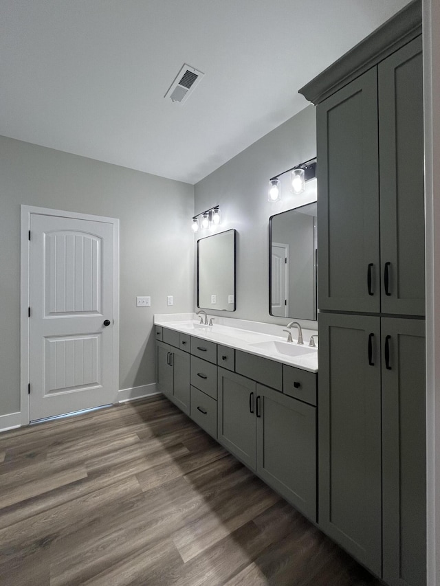 168 Bueno Xing, Georgetown, KY 40324 - bathroom featuring double vanity, wood finished floors, and baseboards